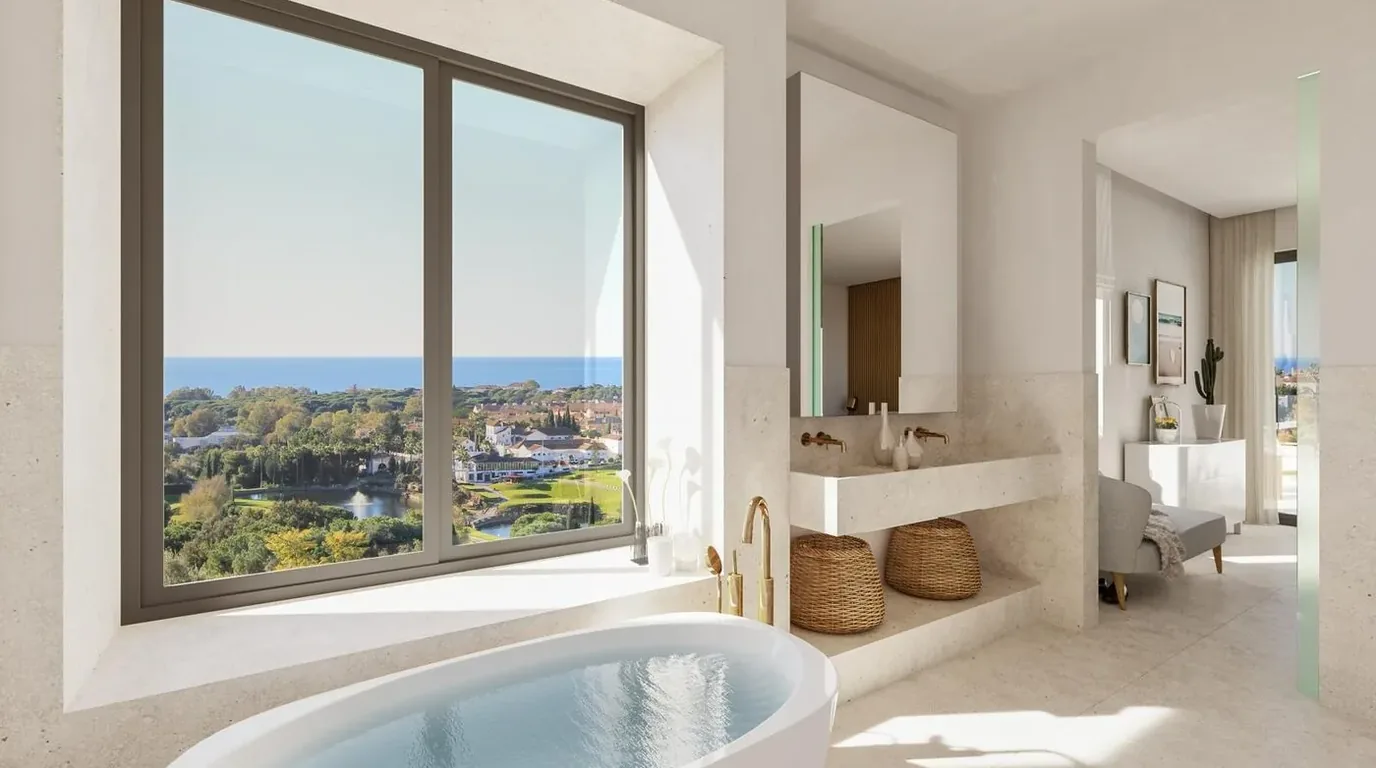 Baño reformado con bañera exenta y ventanal al exterior