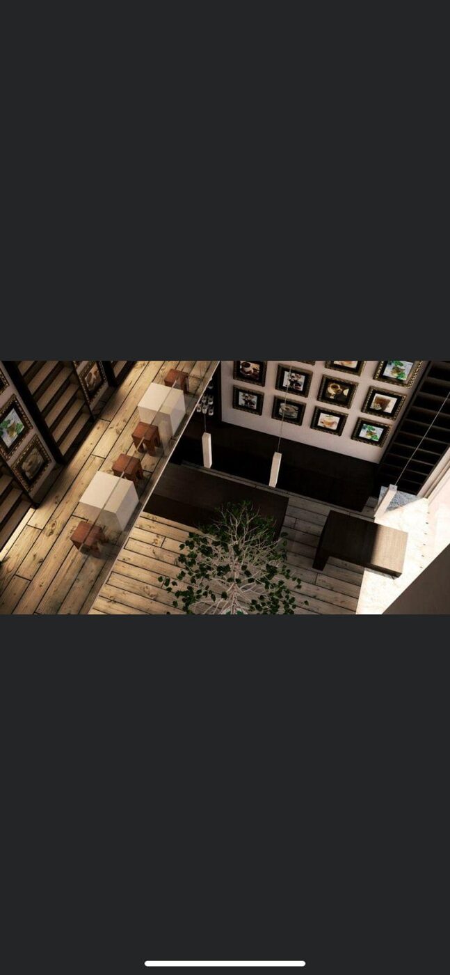 Salón con escalera y galería de cuadros